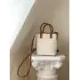 Factory wholesale PU fabric hand bag drawstring design tote bag women weaving design diagonal bucket bag ladies