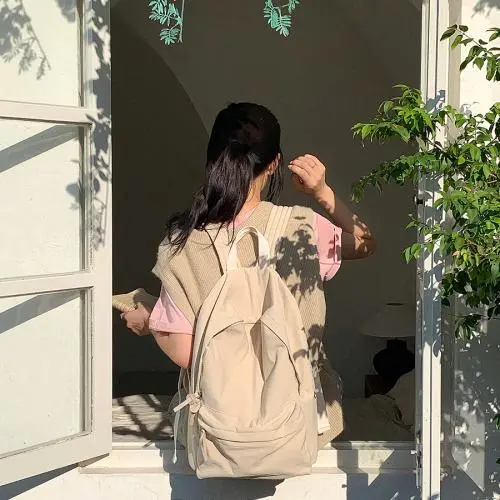 Wholesale school season student schoolbag girl  custom logo casual nylon backpack light simple style backpack women