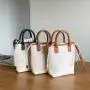 Factory wholesale PU fabric hand bag drawstring design tote bag women weaving design diagonal bucket bag ladies