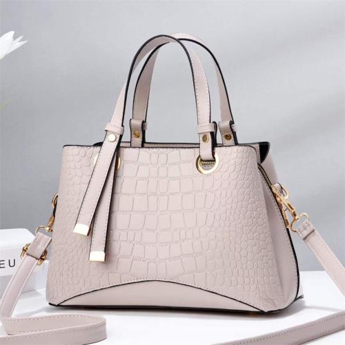2023 New Solid Color Versatile Tassel Stone Pattern One Shoulder Handheld Cross border Large Capacity Light Luxury Stylized Wome