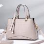2023 New Solid Color Versatile Tassel Stone Pattern One Shoulder Handheld Cross border Large Capacity Light Luxury Stylized Wome