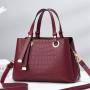 2023 New Solid Color Versatile Tassel Stone Pattern One Shoulder Handheld Cross border Large Capacity Light Luxury Stylized Wome