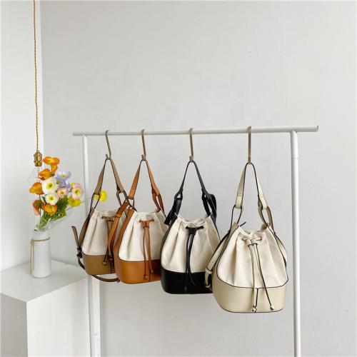 Bag female  2021 summer Korean edition fashion trend skew cross bag personality spliced canvas hand-held bucket bag