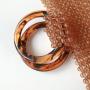 Customized 2024 new hand-woven coffee handbag simple retro acrylic women's round handle bag hollow vegetable basket clutch