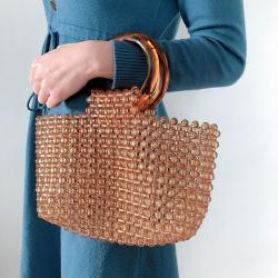 Customized 2024 new hand-woven coffee handbag simple retro acrylic women's round handle bag hollow vegetable basket clutch