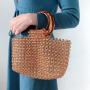 Customized 2024 new hand-woven coffee handbag simple retro acrylic women's round handle bag hollow vegetable basket clutch