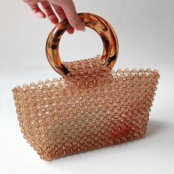 Customized 2024 new hand-woven coffee handbag simple retro acrylic women's round handle bag hollow vegetable basket clutch