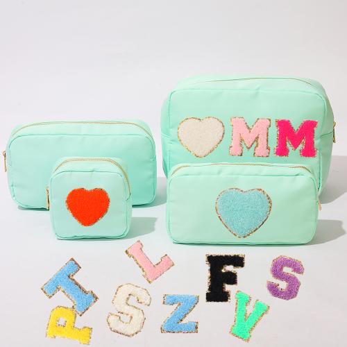 Manufacturer Stock Cute Fashion Pink Nylon Waterproof Travel Large Capacity Portable Custom Logo Letter Cosmetic Bag